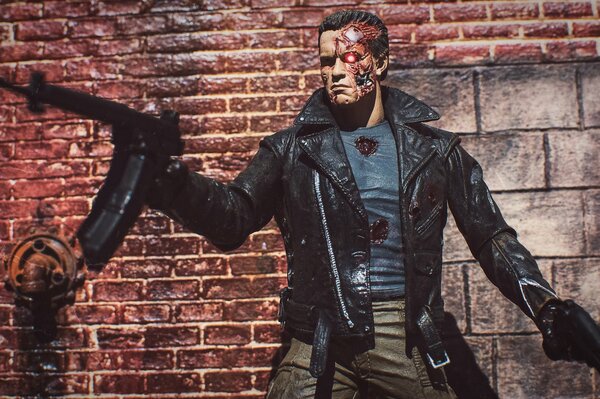 Terminator con una pistola en la mano y una chaqueta negra