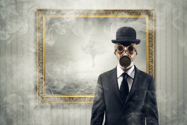 A man in a gas mask in a classic suit against a background of smoke