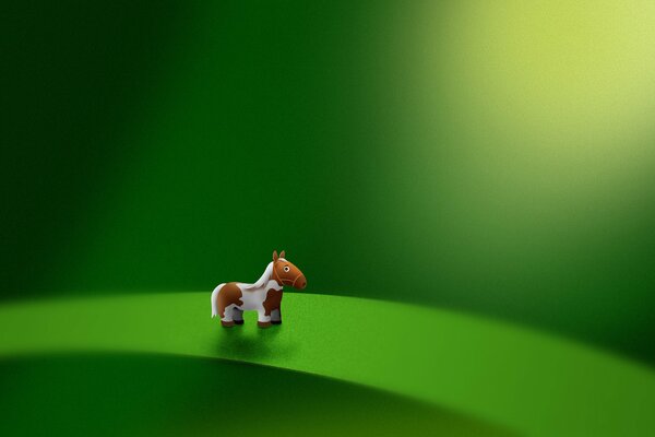 Petit poney sur une feuille verte