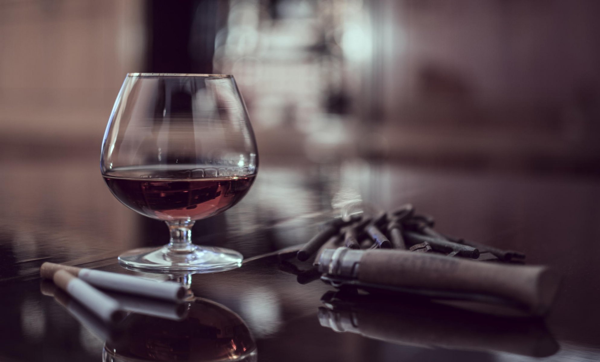 table glass brandy cigar cigarettes close up