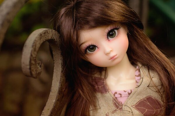 A beautiful brown-haired doll with green eyes