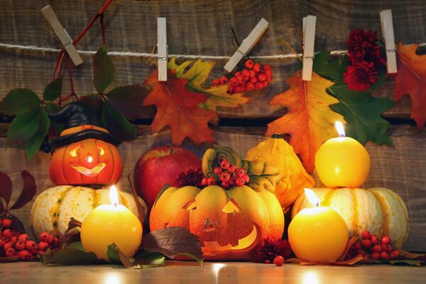 Pumpkins with faces and autumn leaves
