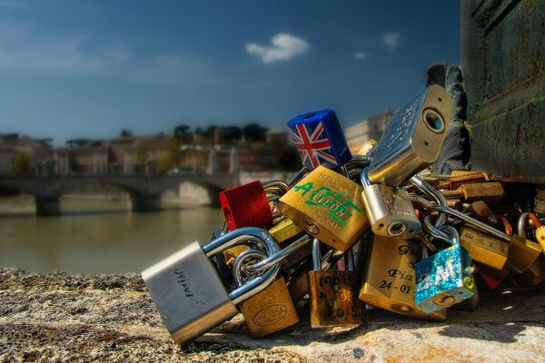 A bunch of locks on the background of the Sant Angelo bridge