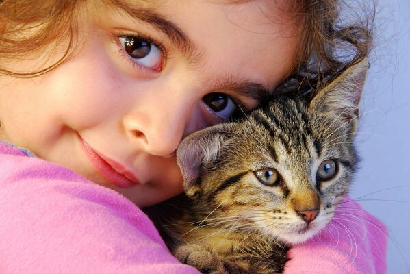 Beautiful eyes of a girl and a cat