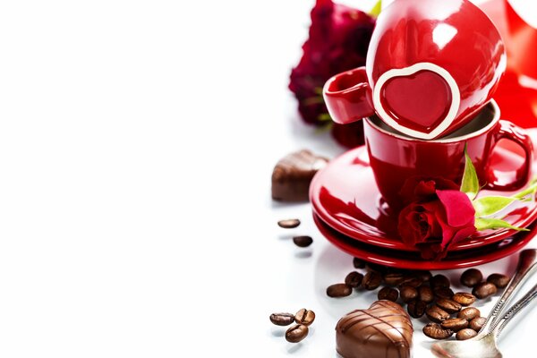 Stillleben mit Tassen, Rosen und Süßigkeiten