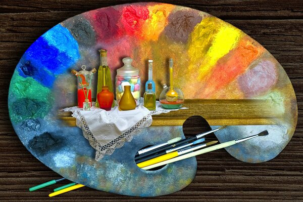 Painting on a palette with paints and brushes