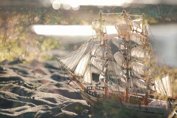 Decorative boat on the sandy shore