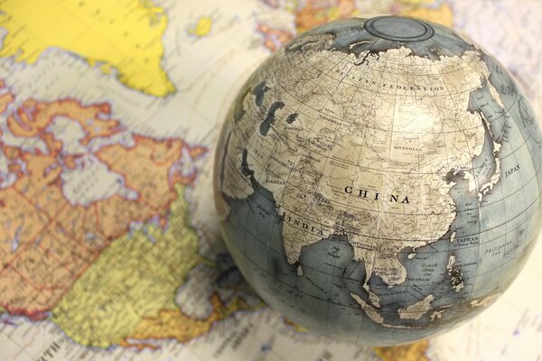 Globe on the background of the world map