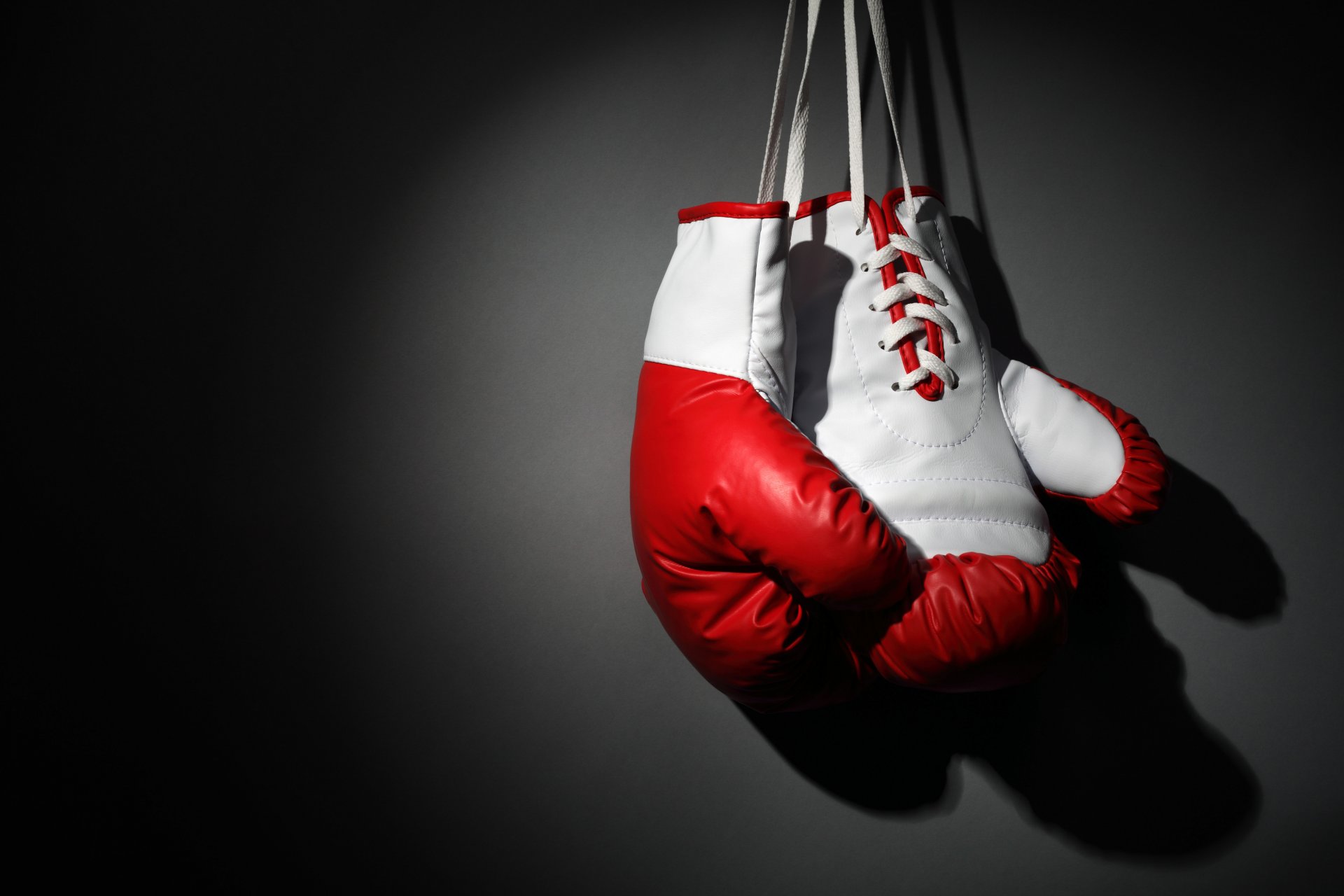 martial arts boxing boxing gloves hang on the wall beautiful background gray background wallpaper