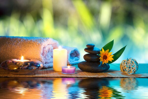 Relax in the spa, stones, candles, flowers