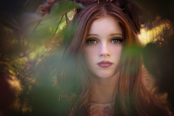 Photo of a long-haired girl against the background of the autumn season