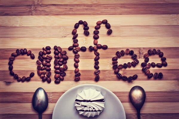 The word Coffee is lined with coffee beans