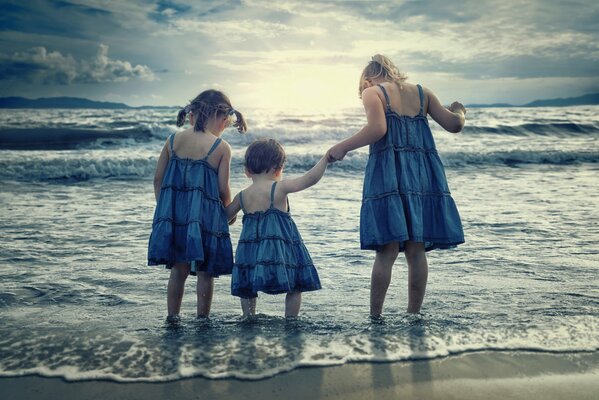 Happy children enjoy the surf