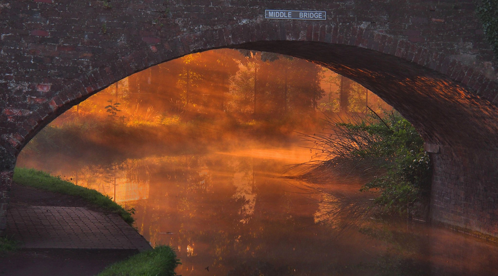 bridge river arch sunset fog