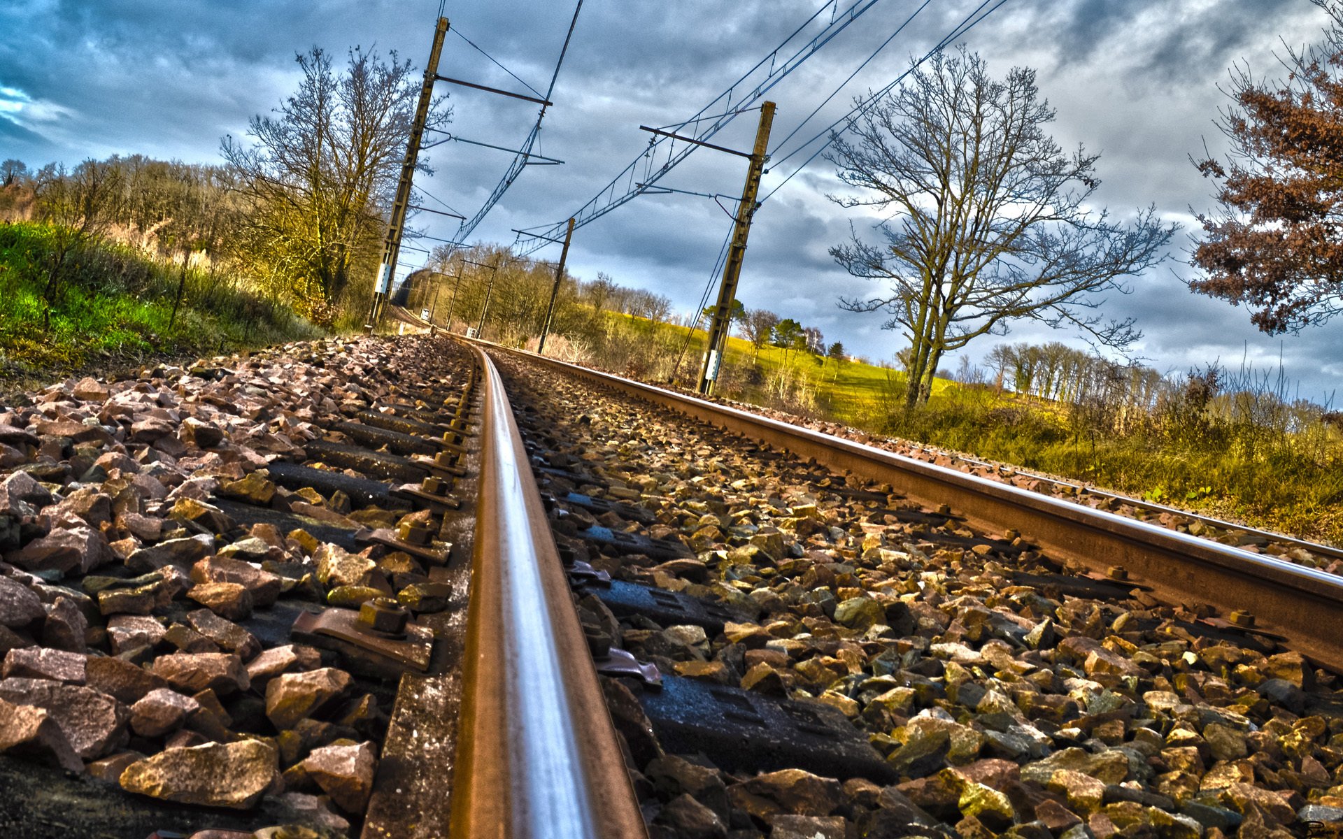 tones railroad rails clouds tree