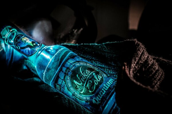 Blue quantum bottle of kernels-Cola glitters wallpaper