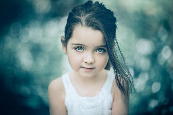 Portrait of a little girl with a lock of hair