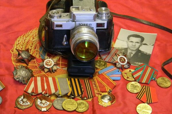 A camera on medals and an old photo