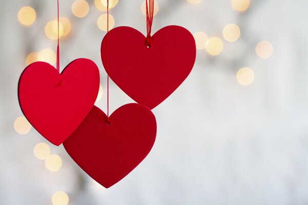 Red hearts on a ribbon - decoration for Valentine s Day