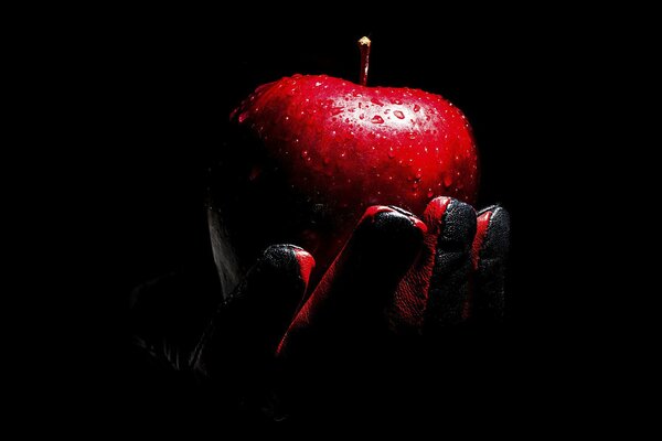 Red ripe apple in your hands