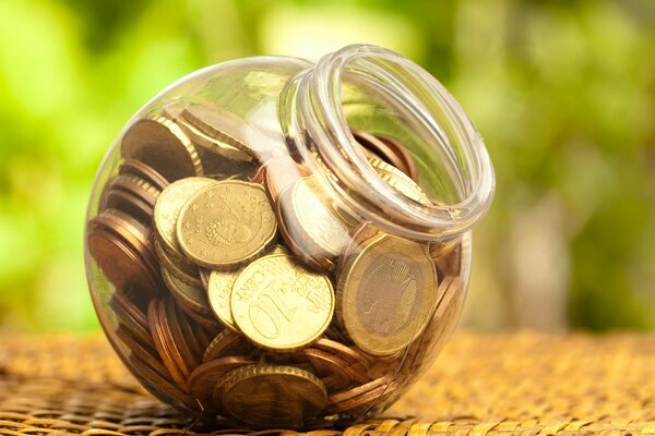 Macro shooting of coins in a plastic jar