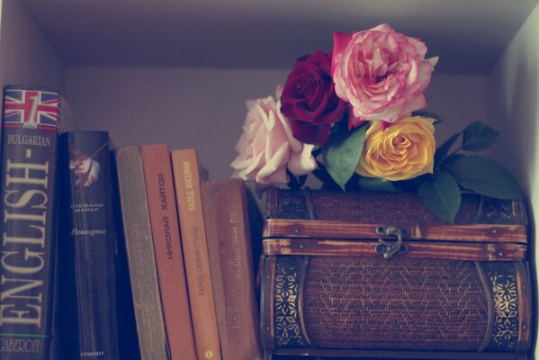 An aesthetic photo with books and flowers