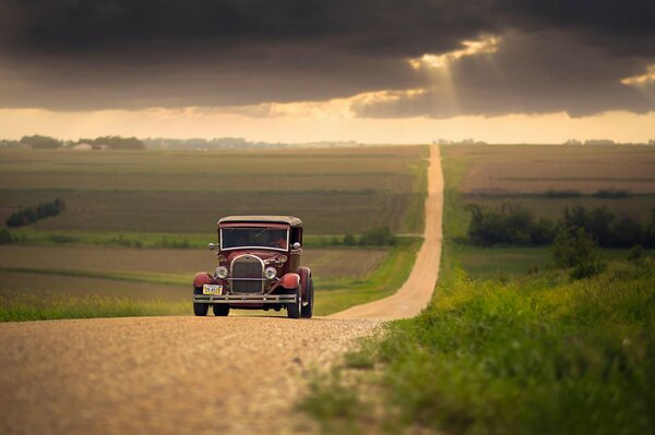 Retro car rides on a vertical slope