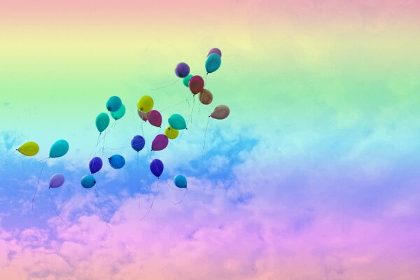 Balloons are flying on a rainbow background