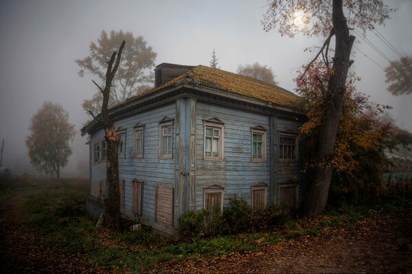 An abandoned lonely house in the fog