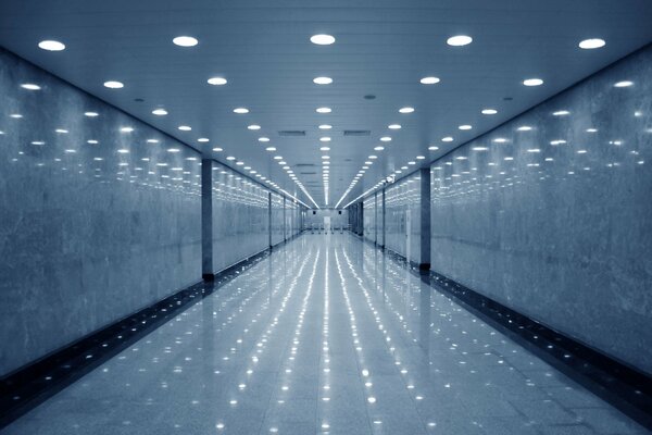 An empty corridor lit by light bulbs