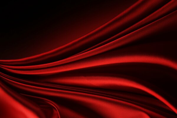 Abstract pattern of bends of red fabric