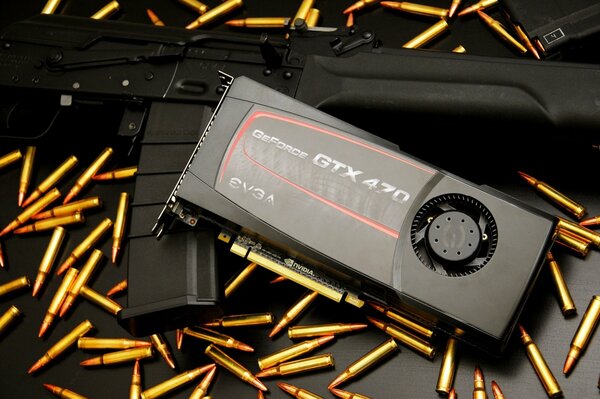 Видеокарта geforce gtx 470 лежит на автомате и патронах