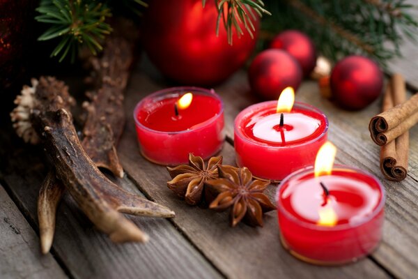 Romantic composition with candles and cinnamon