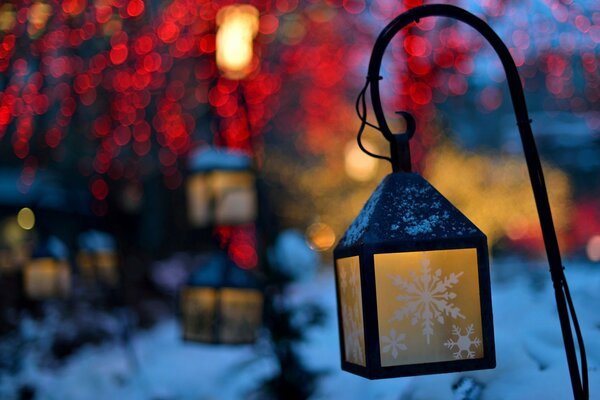 Flashlights with a snowflake on a winter background