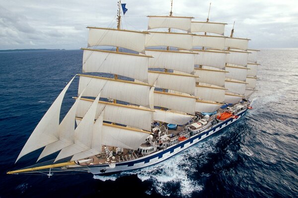 A huge five-masted sailboat at sea