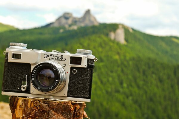 Camera lens on the hill next to the rocks