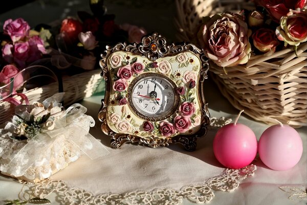 Beautiful clock and candles next to the basket