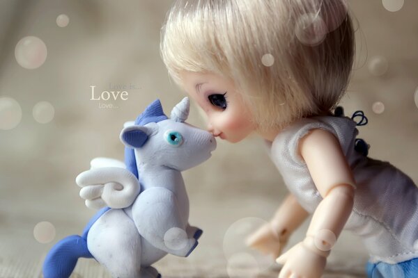 Tenderness and love between a doll and a unicorn