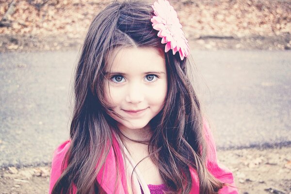 Beautiful girl with a flower on her head