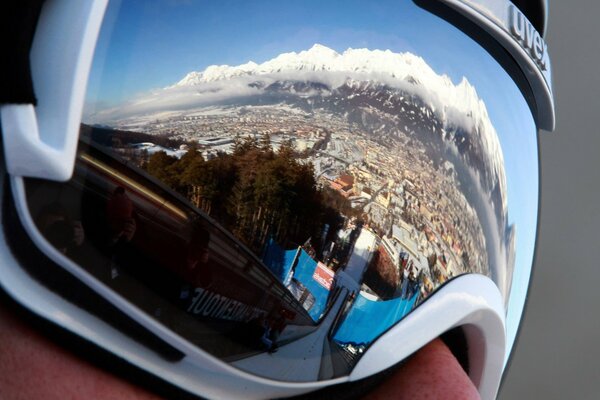 Reflection in the glasses of a snowy winter city