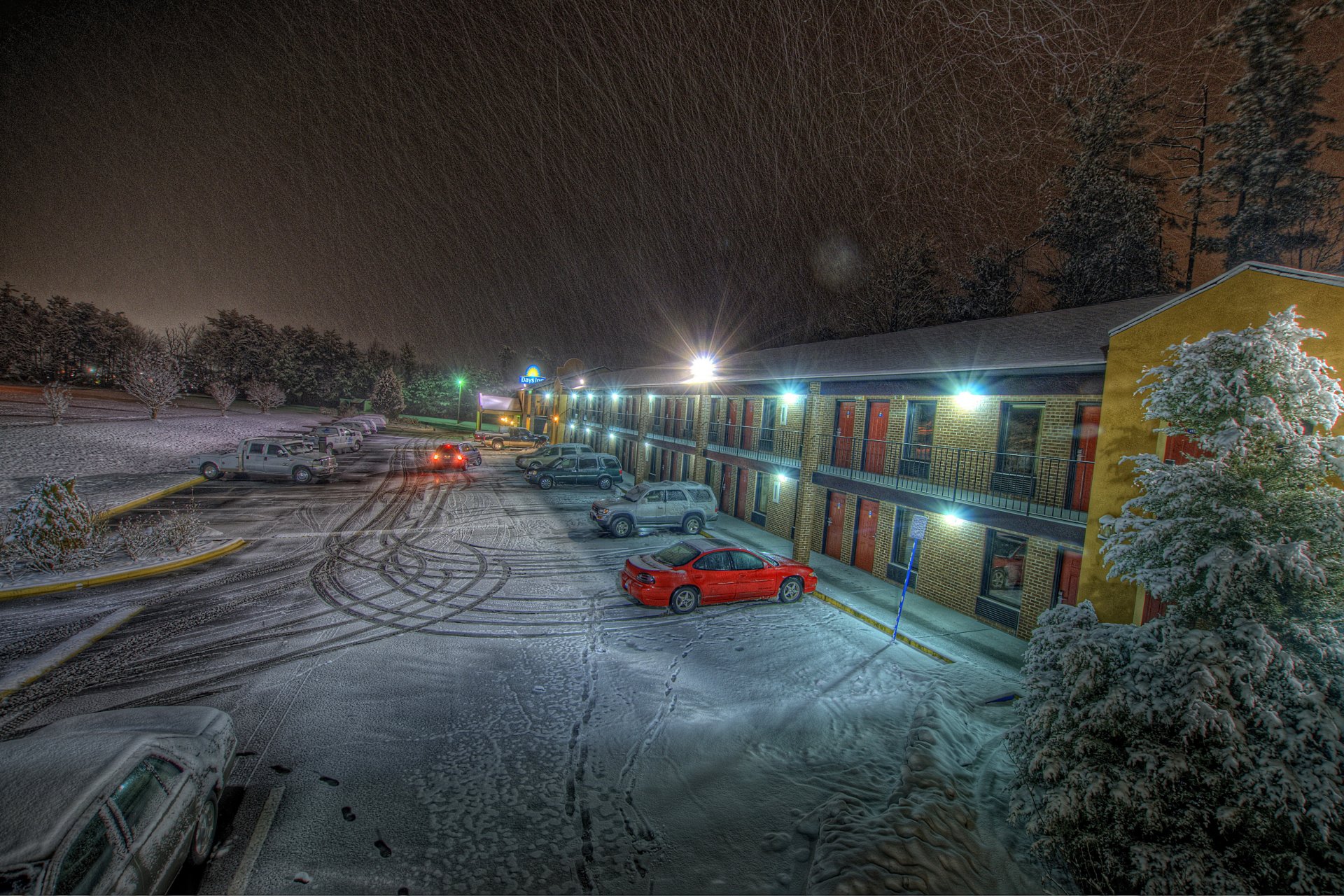 hotel parking cars snow night trace