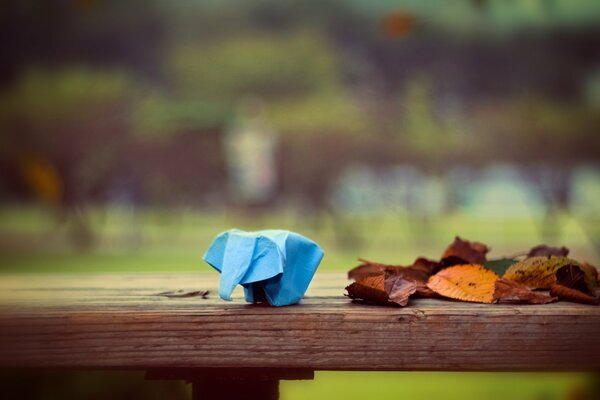 Making origami on a bench