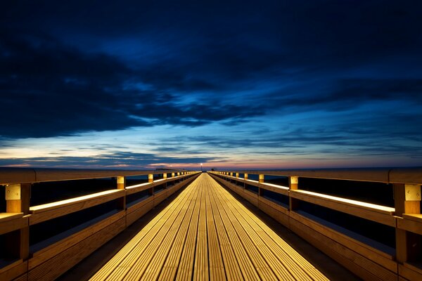 Beautiful landscape with sunset on the background of the bridge