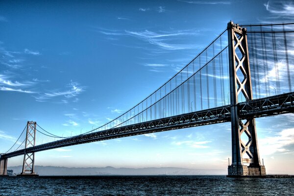 Metal bridge on a blue sky background