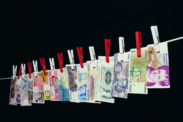 Clothespins attached money bills