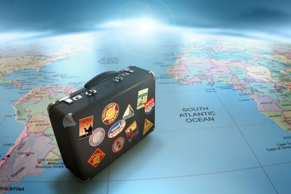 Traveling with a suitcase on the world map