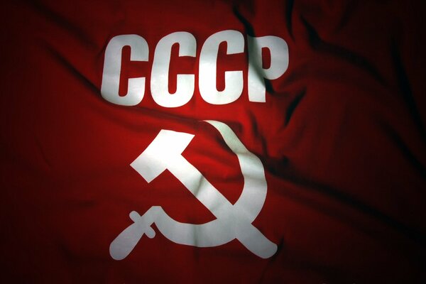 Dark red flag of the USSR with hammer and sickle