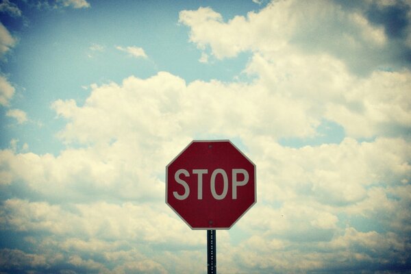 A stop sign, supposedly meaning that only the sky is higher