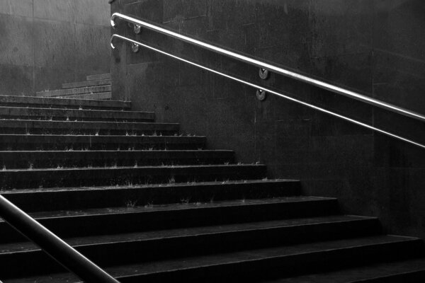 Rain drips on the steps of the underpass