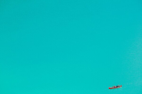 Canoe people in the turquoise sea